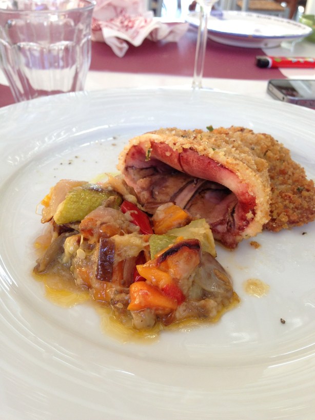 Whole squid with breadcrumbs, barfing up some caponata. It tasted better than it looks.  